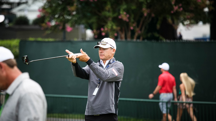 On the practice putting green, Scotty Cameron Tour...